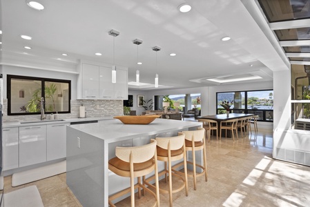 Gather in the bright, breezy great room of Honolulu Lagoonfront Villa—open layout, clean lines, and coastal charm throughout.