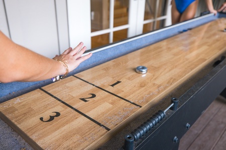 Friendly shuffleboard games become part of the rhythm of afternoons at Moana Lani