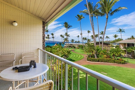Unwind in Napili Shores F-252’s breezy living area with high ceilings and lanai access.