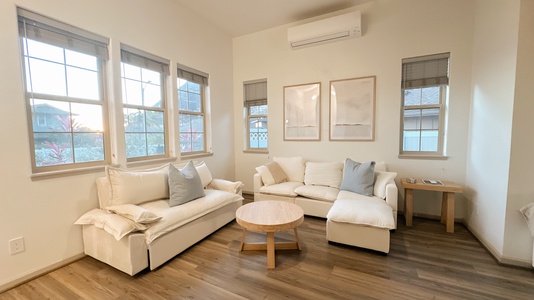 Airy living space with warm light, made for family time and easy conversation.