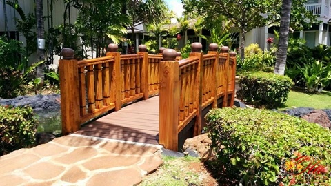 A bridge through the lush green landscape.