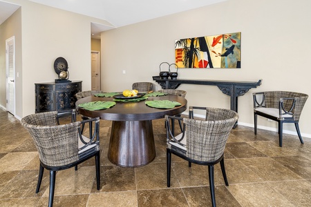Gather at the round dining table for morning Kona coffee or sunset meals with your loved ones.