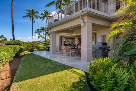 Enjoy the lanai with a BBQ grill and lush garden views, perfect for outdoor dining and relaxation.