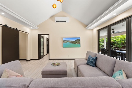 Cozy living room with comfortable seating and a view of the outdoors.