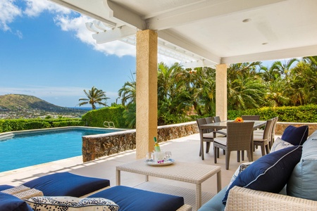 Outdoor dining set, along with a couch and lounger set.