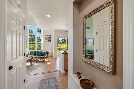 Welcoming entryway with elegant decor, leading into a bright and inviting living space.