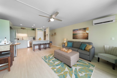 The open concept living area opens up to the kitchen