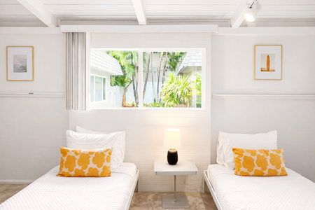 Cozy bedroom one with fun bright tones, attached to the bedroom two.