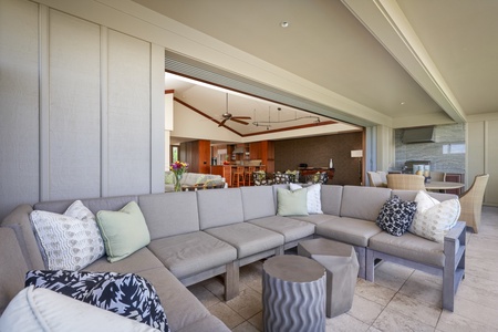 The large outdoor lounging sofa set faces west towards the backyard and ocean.