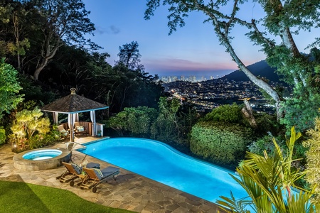 A rare hillside estate surrounded by lush landscaping and your own private poolside paradise.