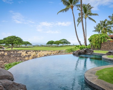 Infinity pool toward the ocean & vast blue sky