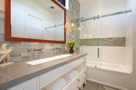 Contemporary bathroom with a glass-enclosed shower and elegant finishes.