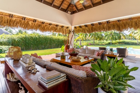 Enjoy the fresh air and garden views in the poolside cabana.
