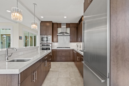The spacious kitchen with wide counter spaces, a chef's delight for breezy meal prep.