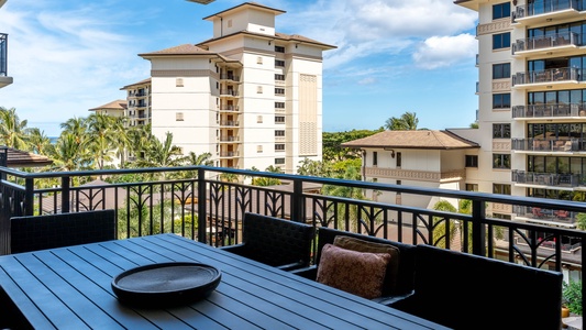 There is a fully equipped kitchen with stainless steel appliances.