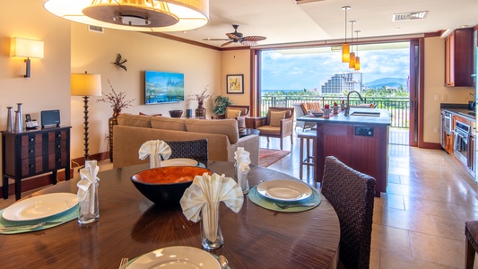 An open floor plan seamlessly connects the kitchen, dining, and living areas for effortless entertaining in this tropical retreat.