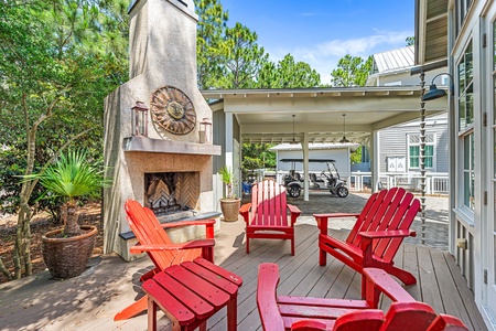 Outdoor fireplace with seating set on back patio