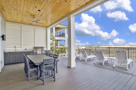 The covered patio serves as a 2nd dining area with seating for 8