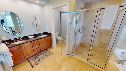 The master bath comes with a double vanity and a walk-in shower