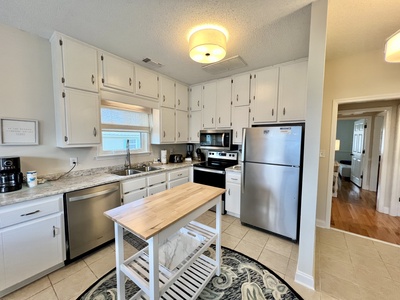 The kitchen features stainless steel appliances