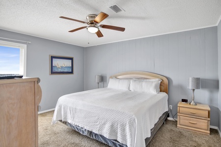 The master bedroom has a King size bed