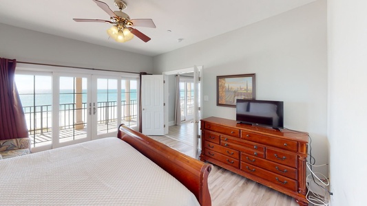 Bedroom 6 features a TV, Gulf views, balcony access and a private luxury bathroom