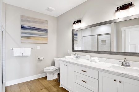 Private master bathroom with a double vanity