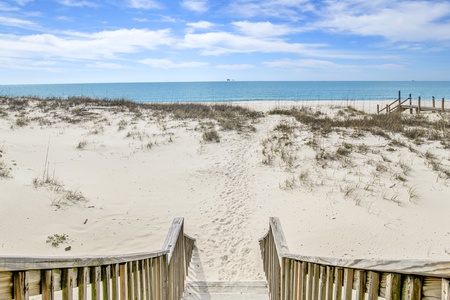 Walk down the steps and touch the sand, steps to the Gulf