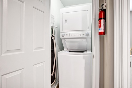 Stackable washer and dryer located in the 2nd floor hallway