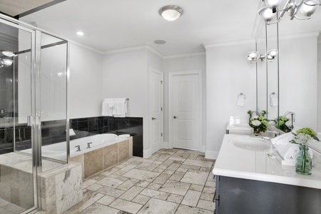 The private bath in bedroom 6 has a double vanity