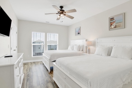 Bedroom 2 is upstairs with 2 queen beds and a television