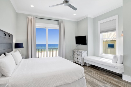 The guest bedroom, located on the 2nd floor with a private bathroom, King bed, Twin bed, TV and balcony access