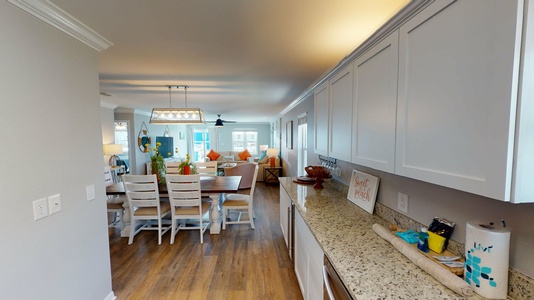 Your view from the kitchen into the open dining/living areas