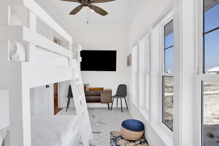 Bedroom 3(bunkroom) comes with a TV and a barn door for privacy