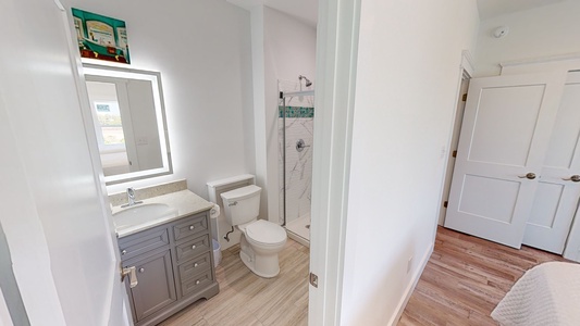 The private bathroom for Bedroom 6 has a walk-in shower