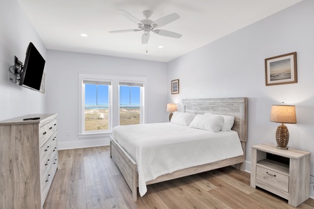 Bedroom 3 on the 2nd floor with a queen bed, Gulf views, ceiling fan, TV and a private bathroom