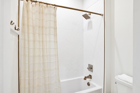 It features a tub/shower combo