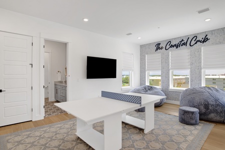 Featuring a ping pong table, TV and private bathroom