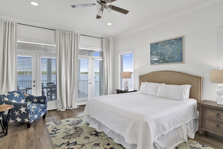 Bama Boat House North master bedroom with a king bed and TV