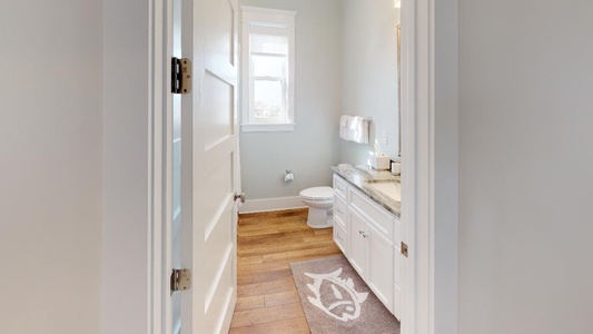 Common area shared bathroom with tub shower combo