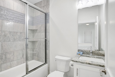 The private bathroom in Bedroom 1 has a tub/shower combo