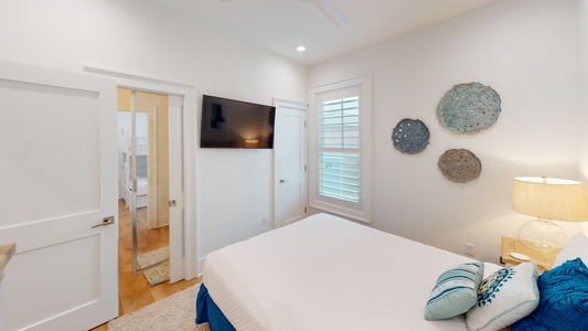 Bedroom 2 comes with a ceiling fan, TV and a Jack-n-Jill bathroom