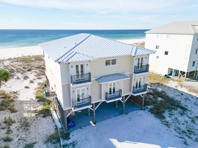 Driveway has parking for large families and cover under the home