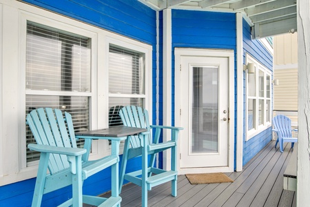 Covered seating and entrance into the home from the pool deck