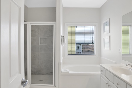 2nd floor bathroom by bedroom 2 has a walk-in shower, soaking tub and a double vanity