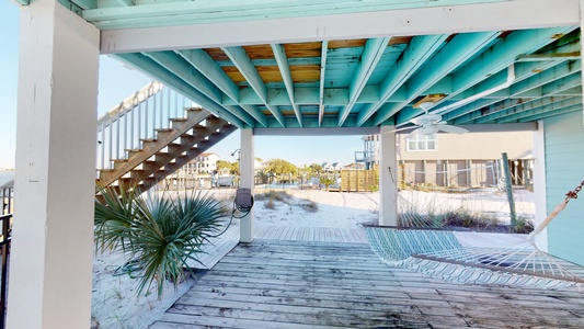 Ground level deck and covered area with a hammock