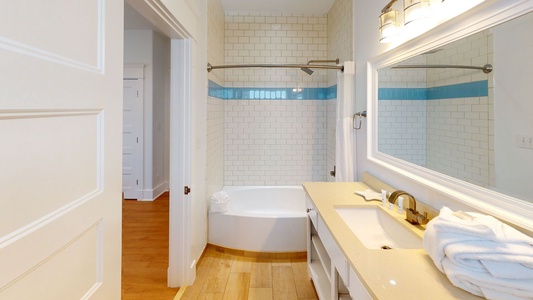The private bathroom in Bedroom #8 has a tub/shower combo