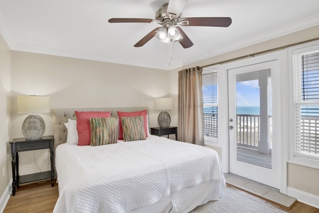 This guest bedroom offers a King bed, balcony access, TV and private bathroom