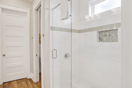 Featuring a walk-in tile shower