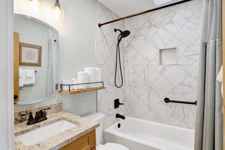 The master bathroom features a tub/shower combo